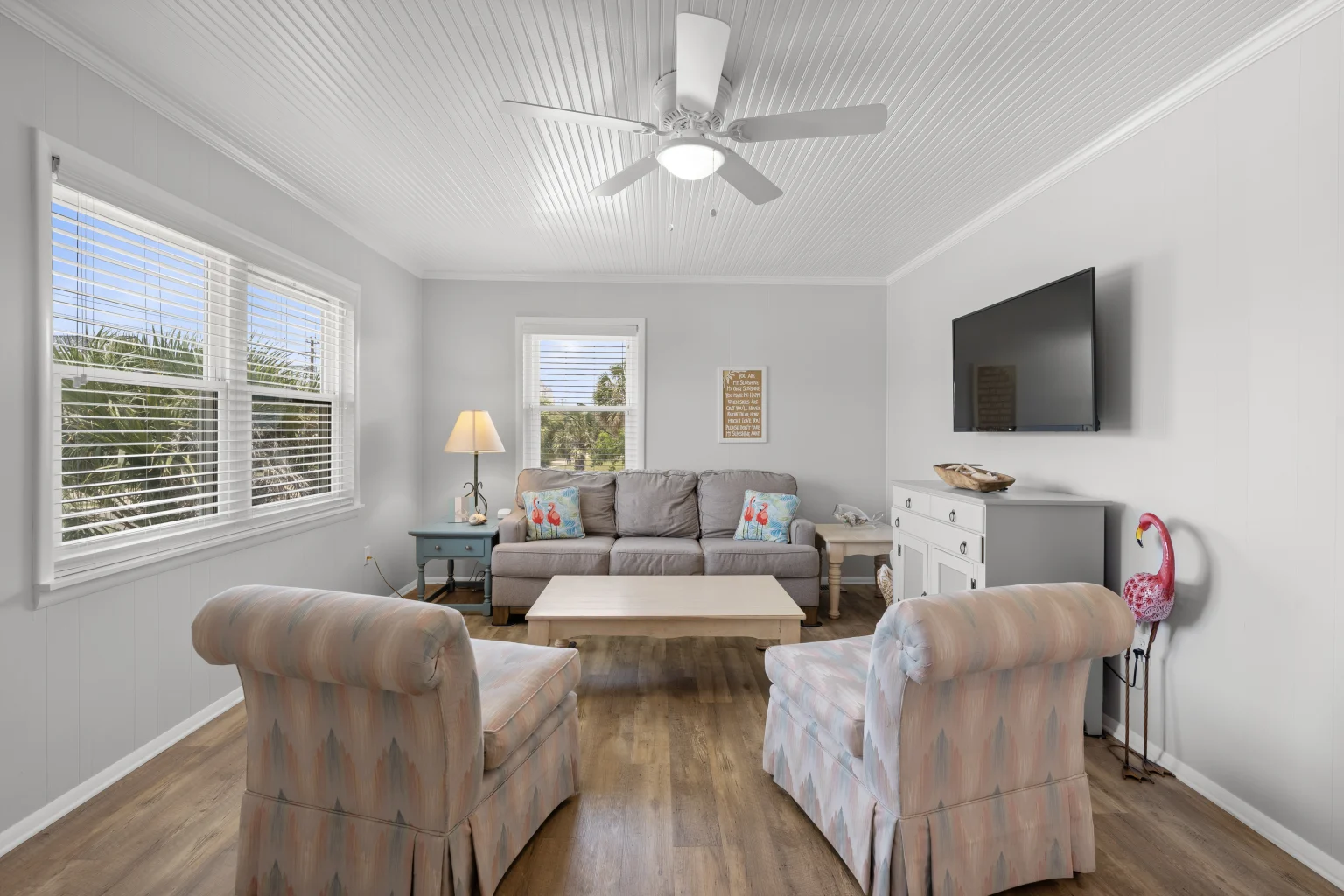 Living room with sofa, armchairs and TV, Beach Cottage