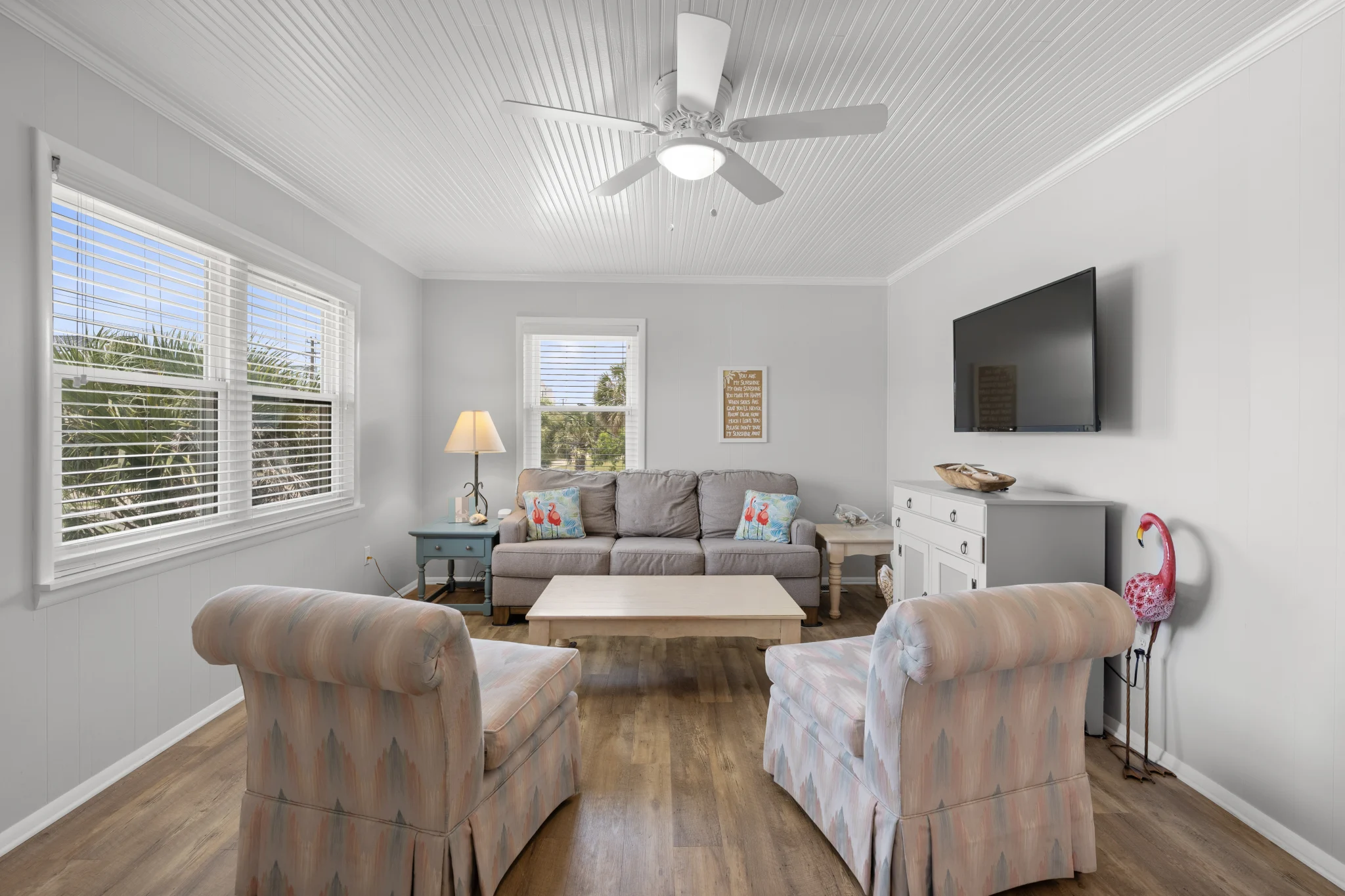 Living room with sofa, armchairs and TV, Beach Cottage