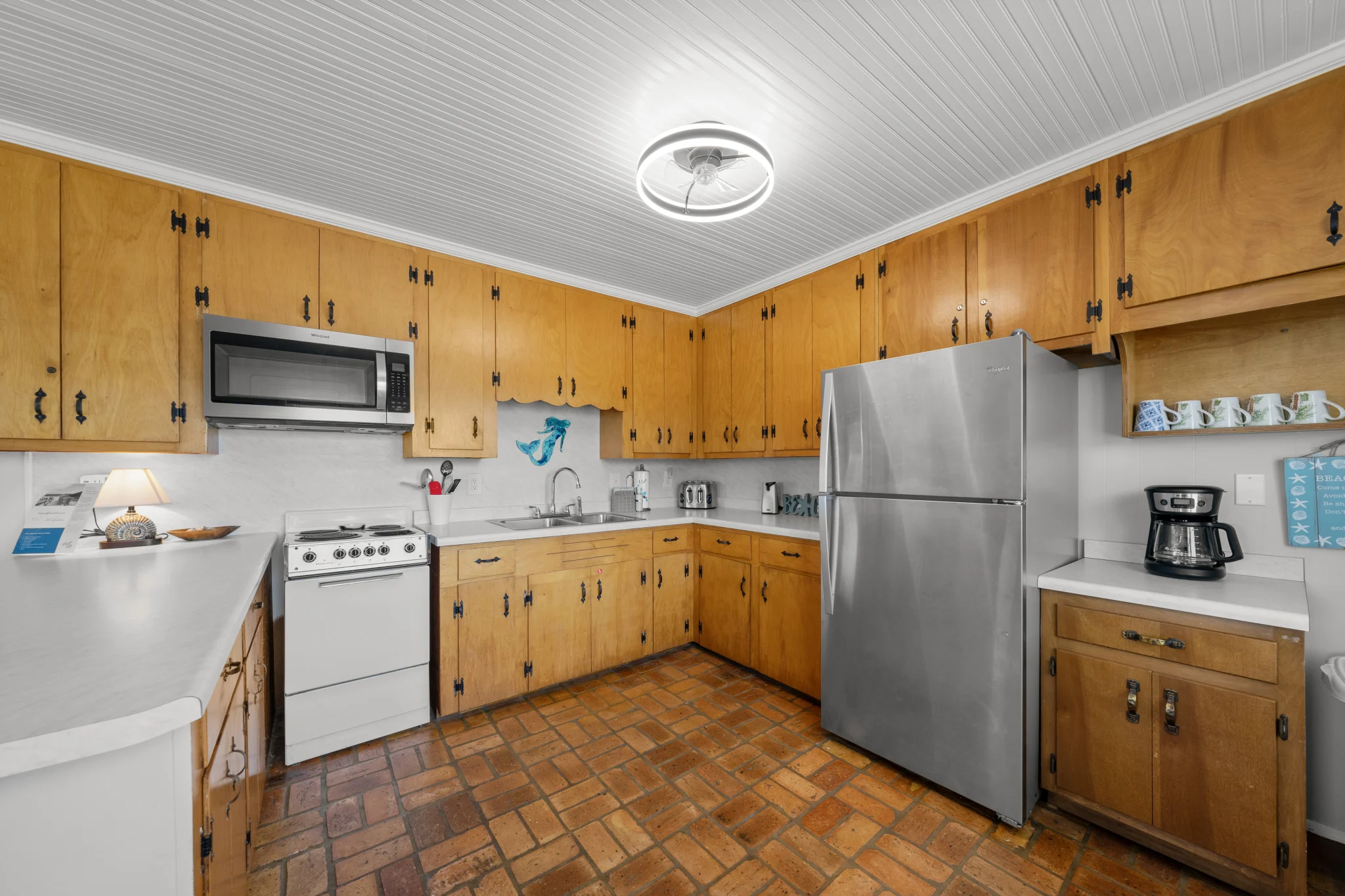 Kitchen with stainless refrigerator, Beach Cottage