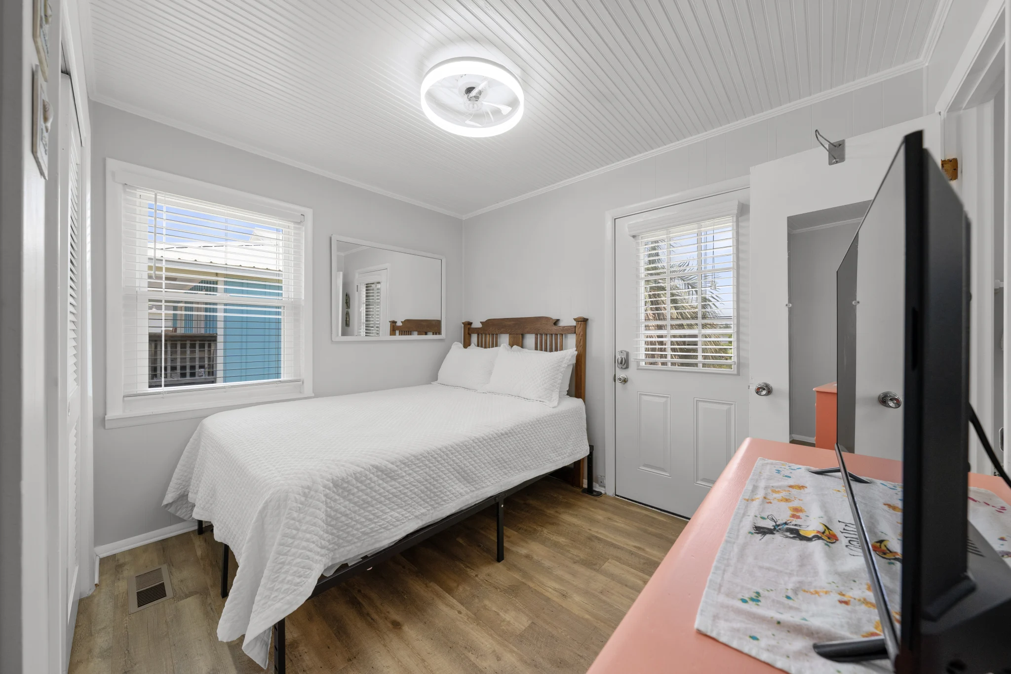 Queen bedroom with door to the deck, Beach Cottage