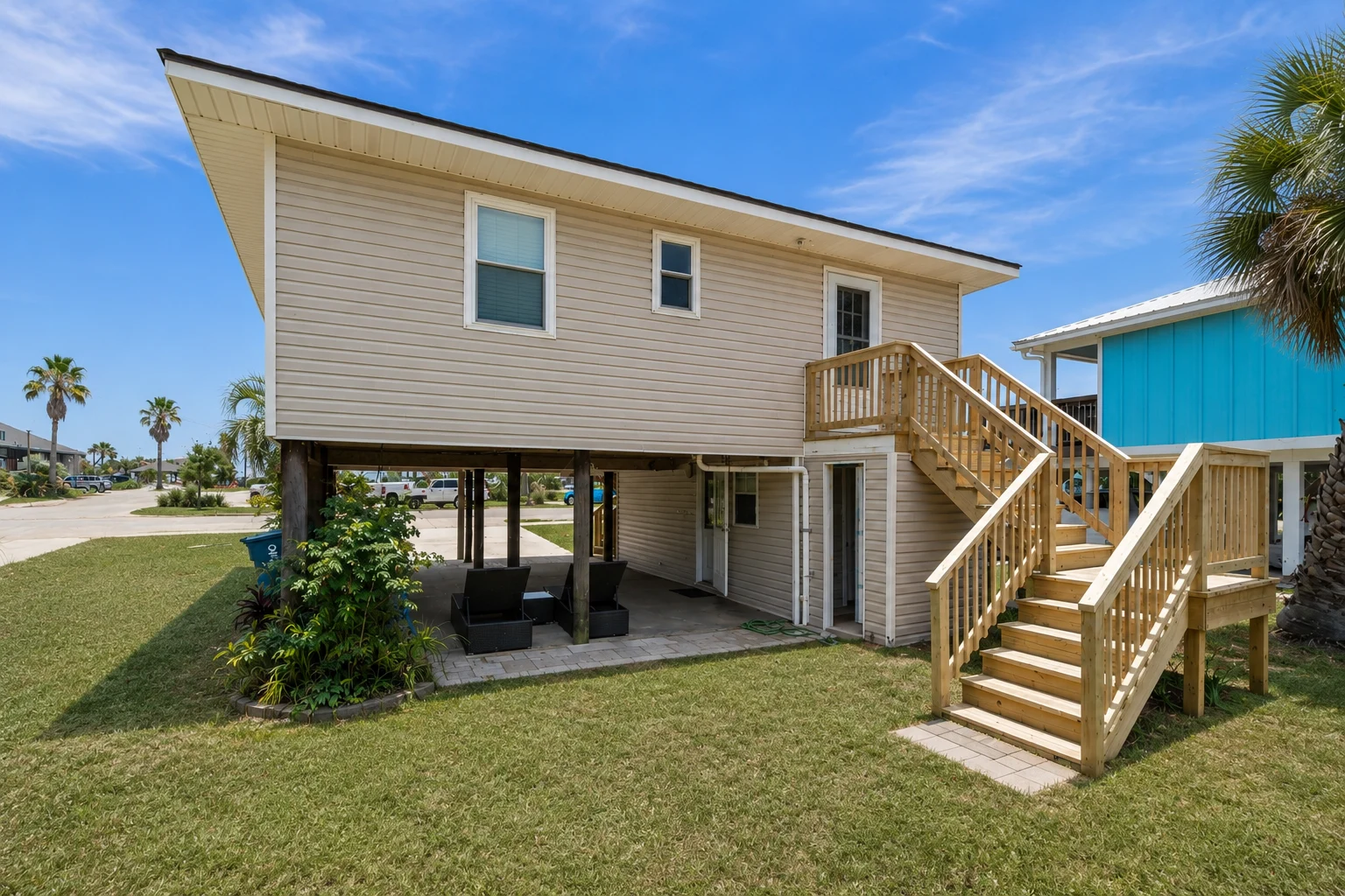 Back of the cottage with stairs and yard, Beach Cottage