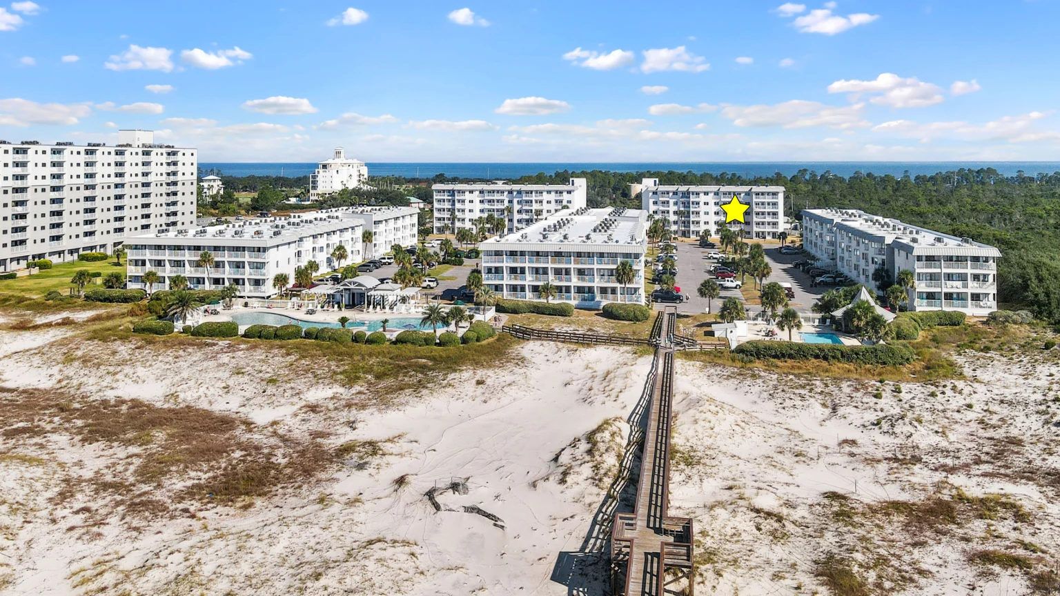 Plantation Resort from the air, with the boardwalk over the dunes to the beach, Emerald Dreams