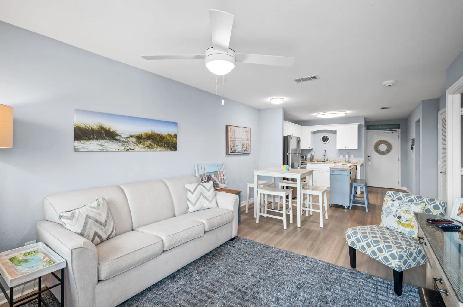 Living room with a sleeper sofa beside the dining area, Emerald Dreams