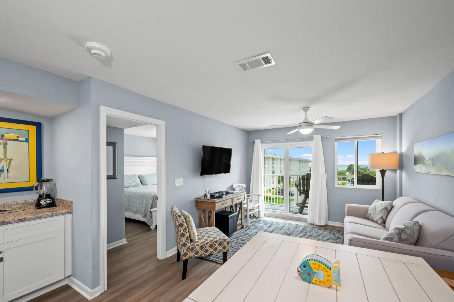 Living area from the entry, balcony doors at the far end, Emerald Dreams