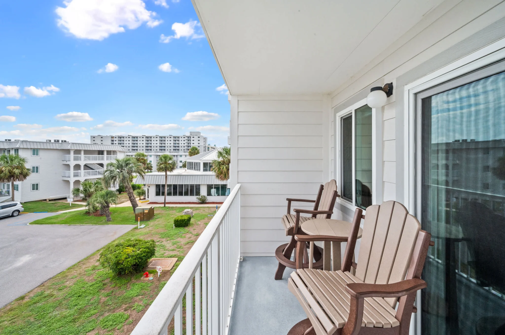 Balcony with two chairs over the resort grounds, Emerald Dreams