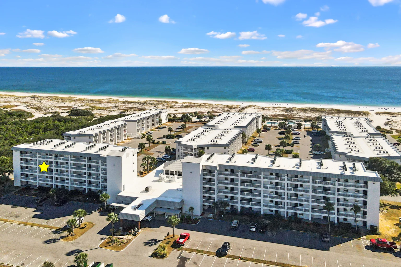 Resort buildings and the beach from the air, Emerald Dreams