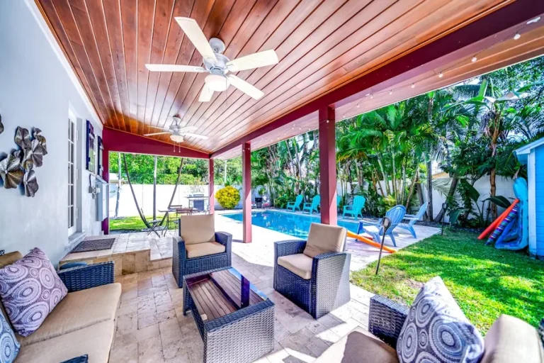 Covered patio beside a heated pool in Delray Beach