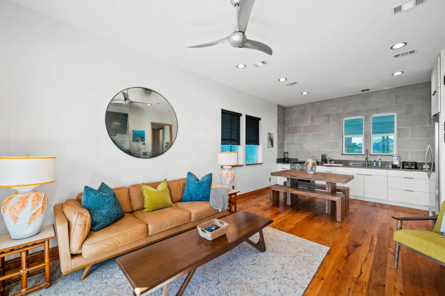 Living room with leather sofa and kitchen beyond, Gulf Pearl