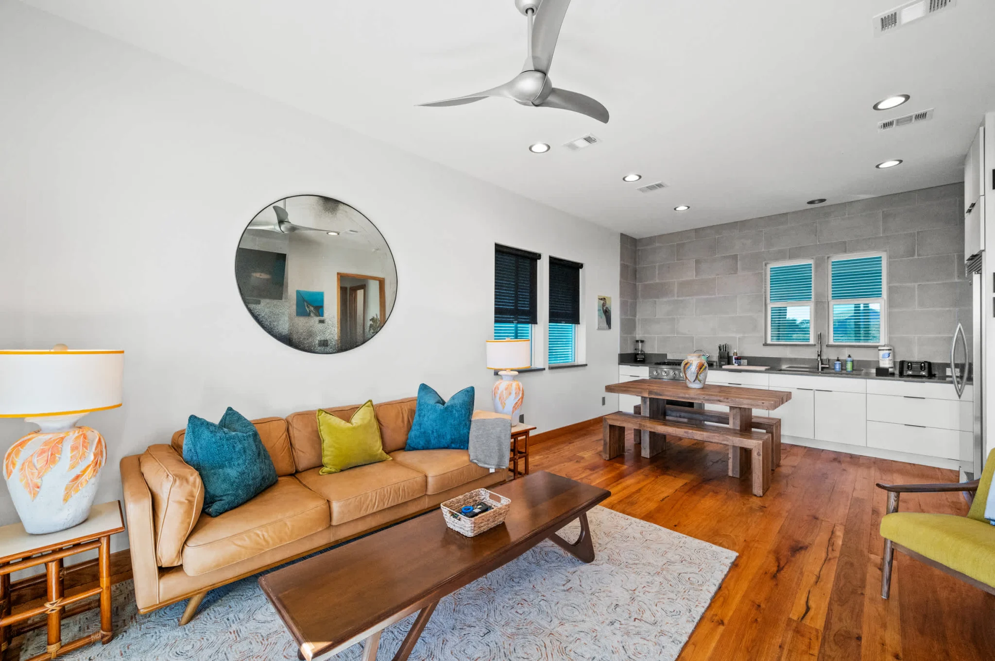 Living room with leather sofa and kitchen beyond, Gulf Pearl