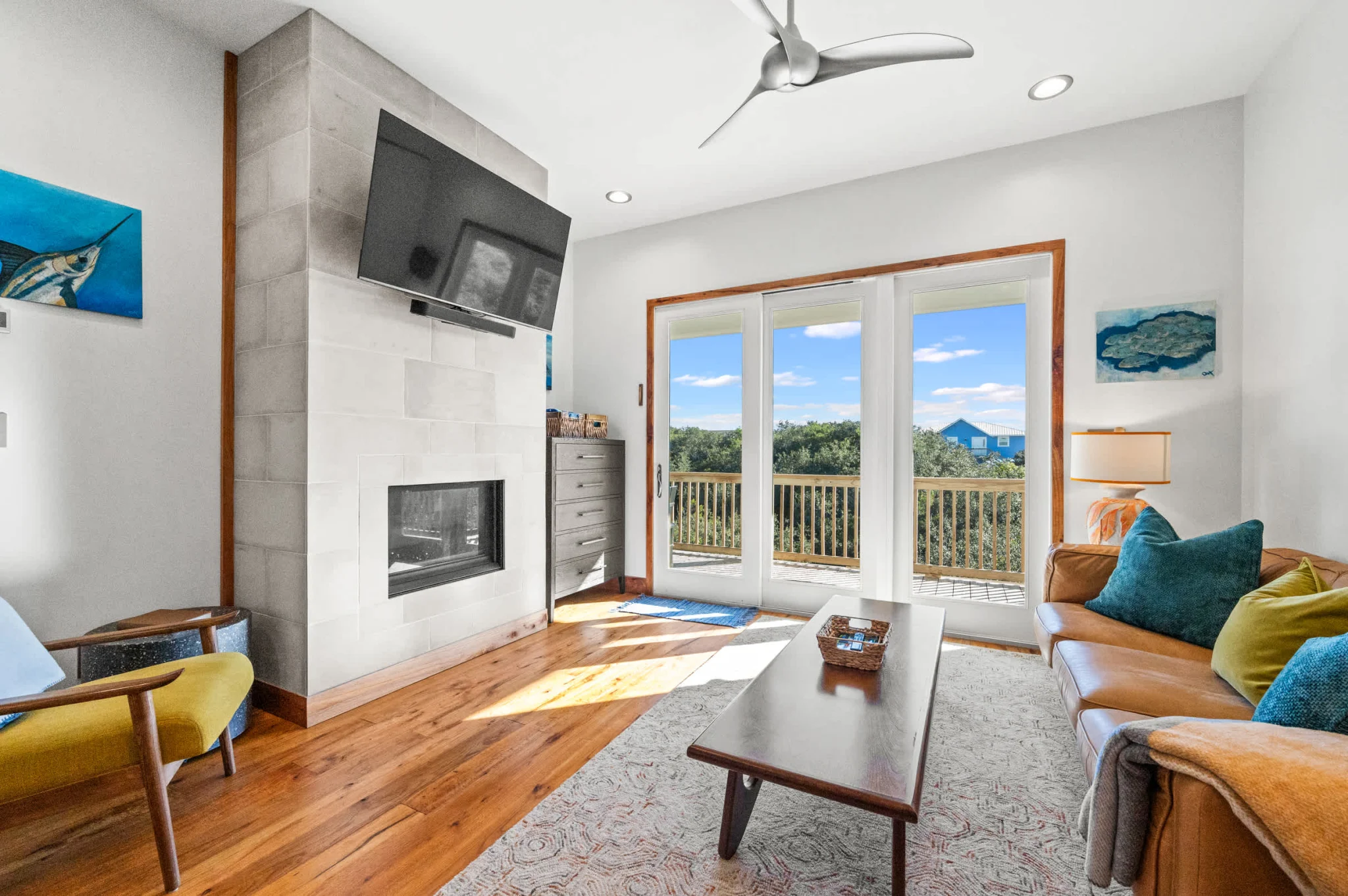 Living room with fireplace, TV and porch doors, Gulf Pearl