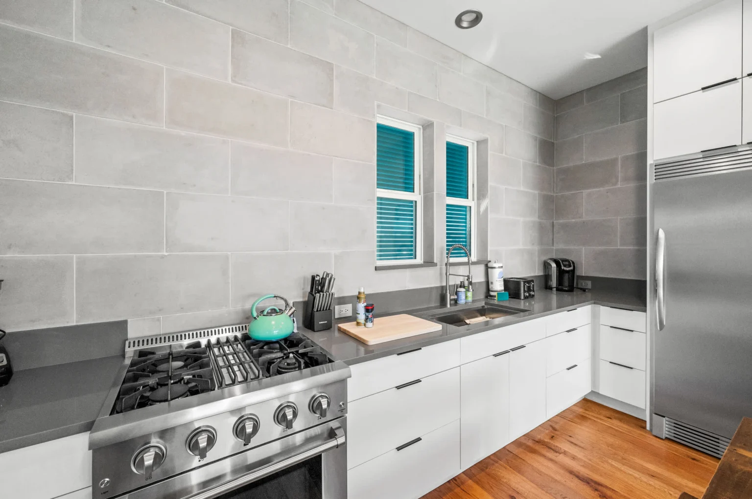 Kitchen with gas range and tall refrigerator, Gulf Pearl