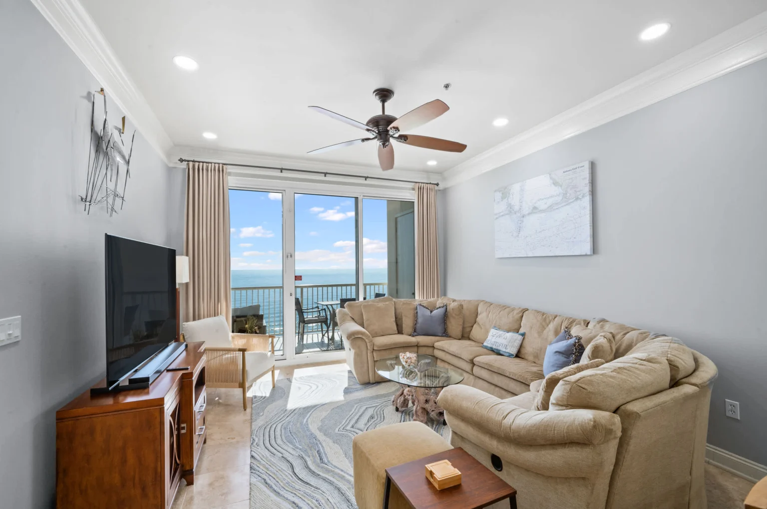 Living room with sectional and balcony doors, High Tide Penthouse