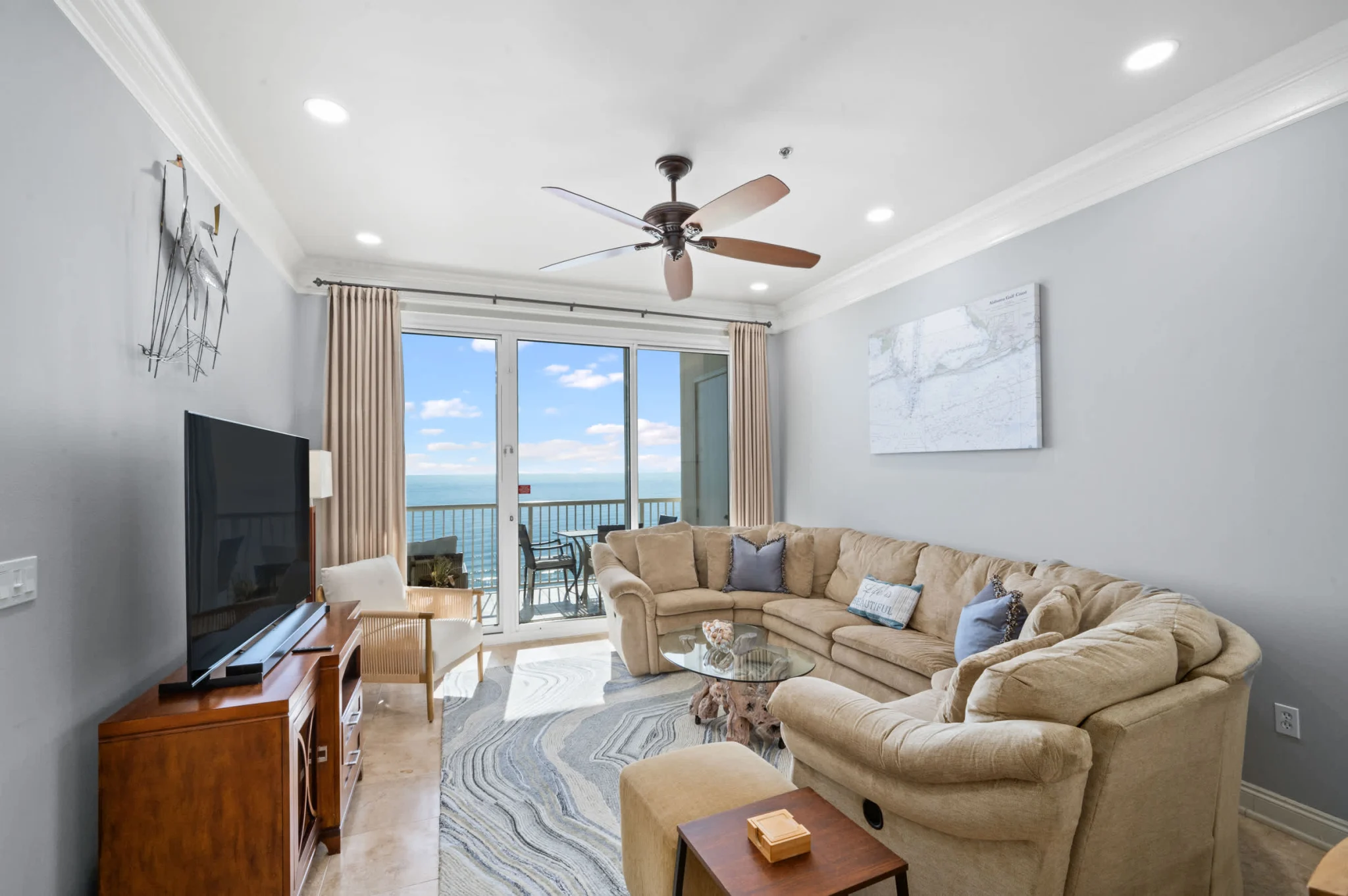 Living room with sectional and balcony doors, High Tide Penthouse