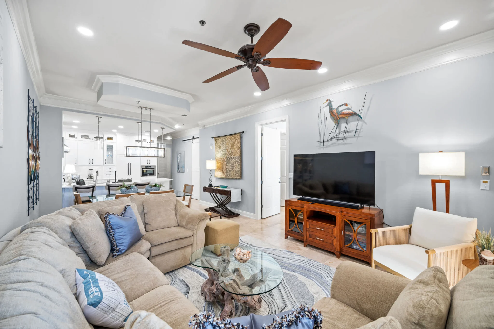 Living room with sectional and TV, High Tide Penthouse