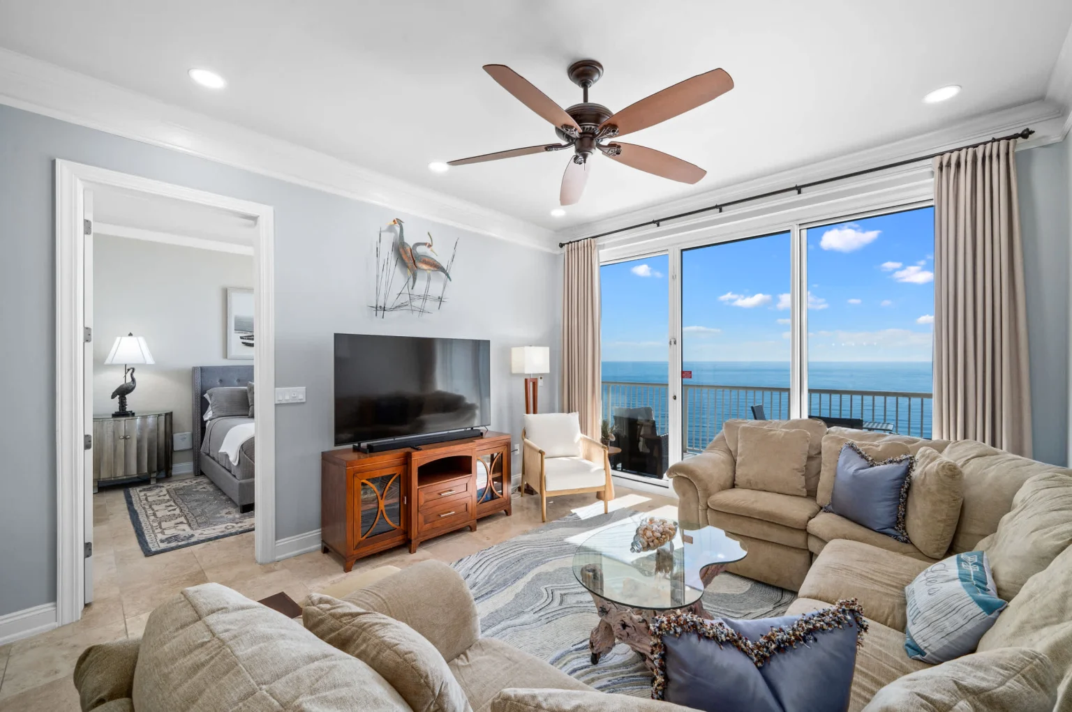 Living room with Gulf view and bedroom beyond, High Tide Penthouse