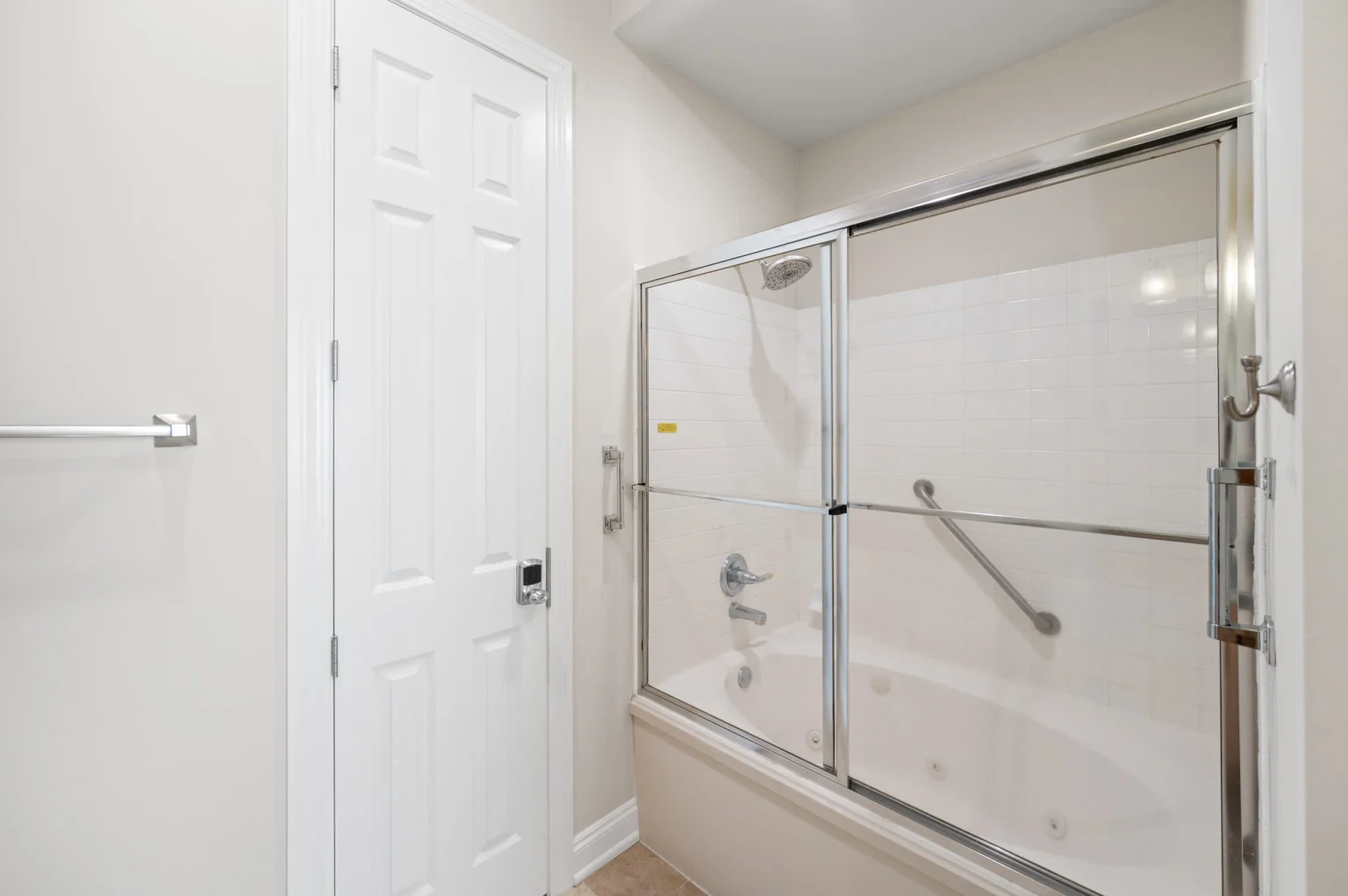 Tub and shower in the primary bathroom, High Tide Penthouse