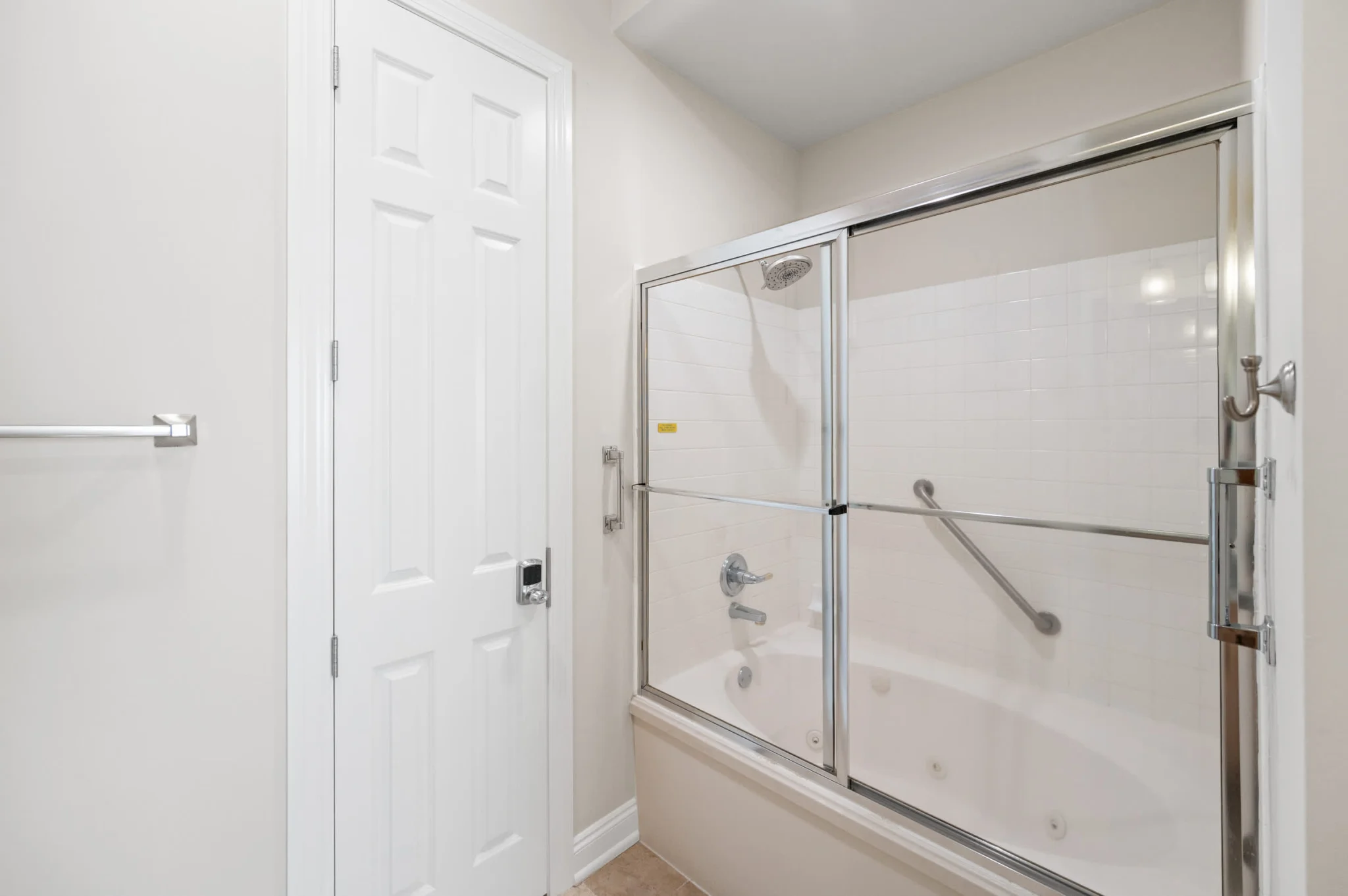 Tub and shower in the primary bathroom, High Tide Penthouse