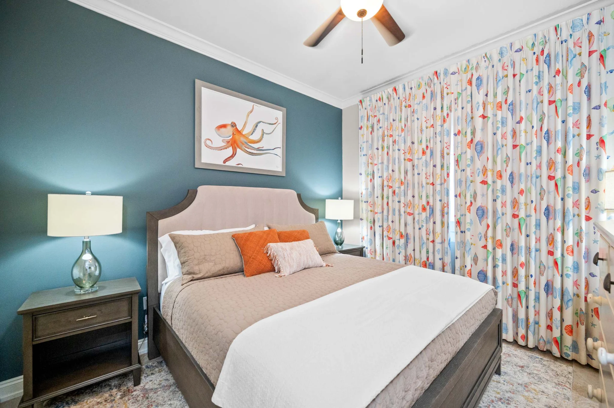 Queen bedroom with octopus art and patterned curtains, High Tide Penthouse