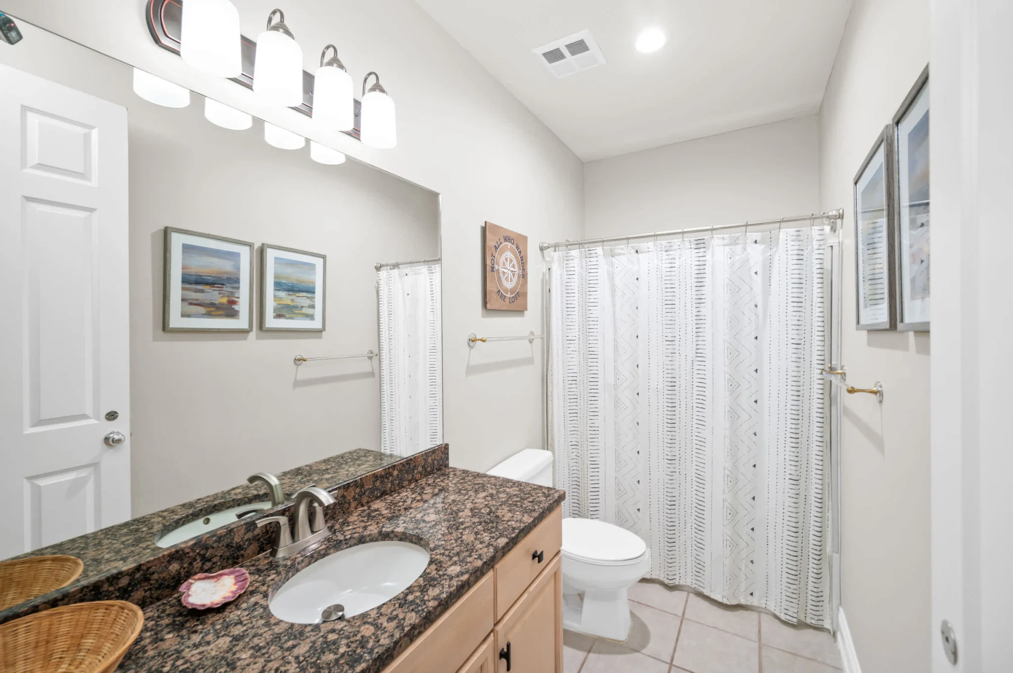 Bathroom with granite vanity and tub, High Tide Penthouse