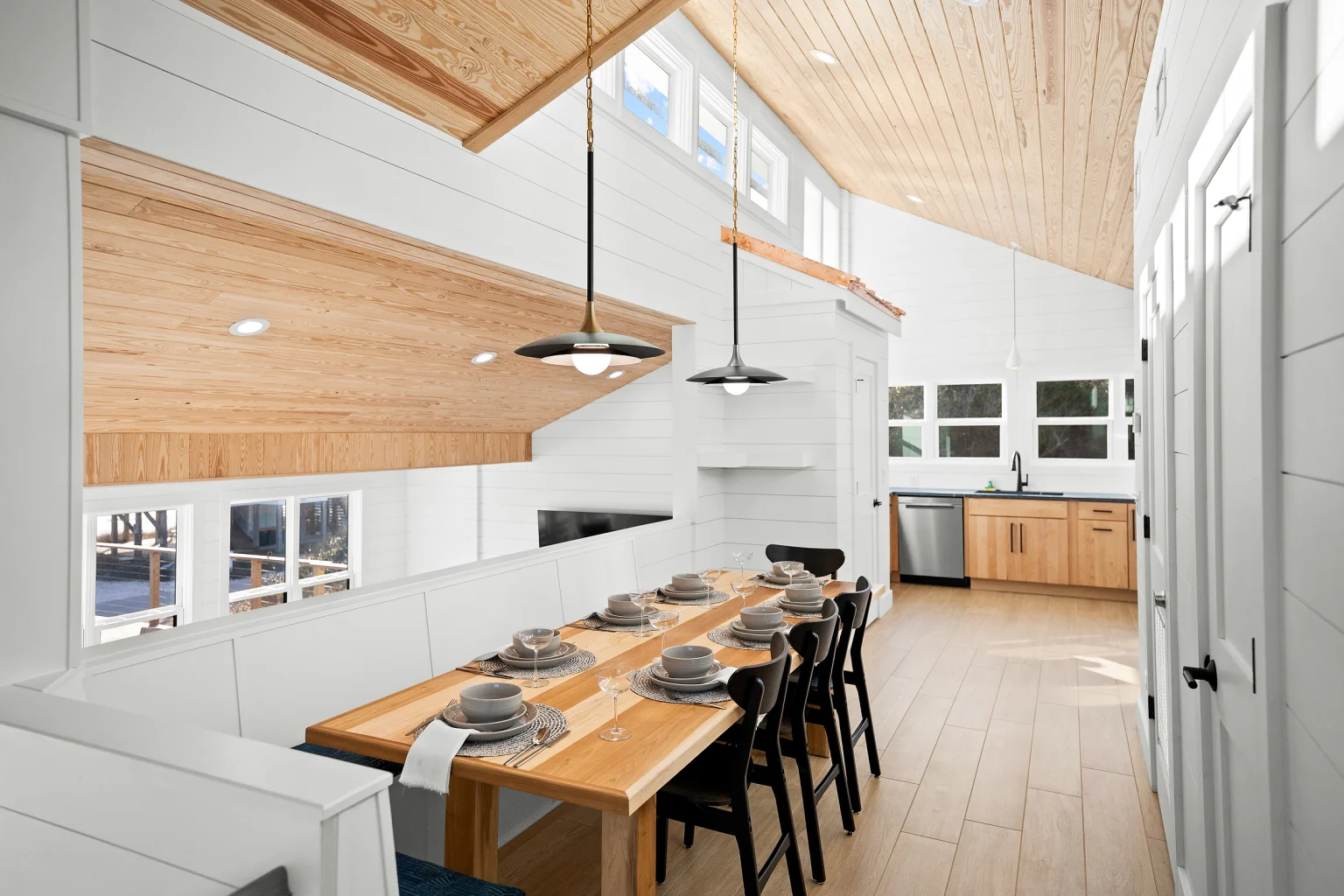 Long dining table under pendant lights, Love Shack
