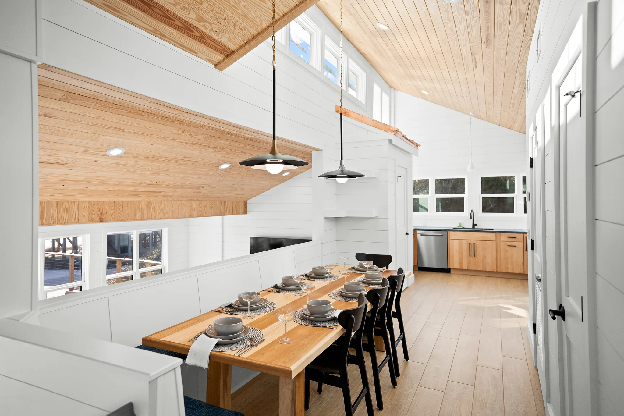 Long dining table under pendant lights, Love Shack