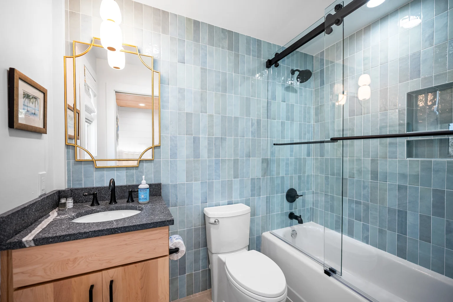 Bathroom with blue tile tub and shower, Love Shack