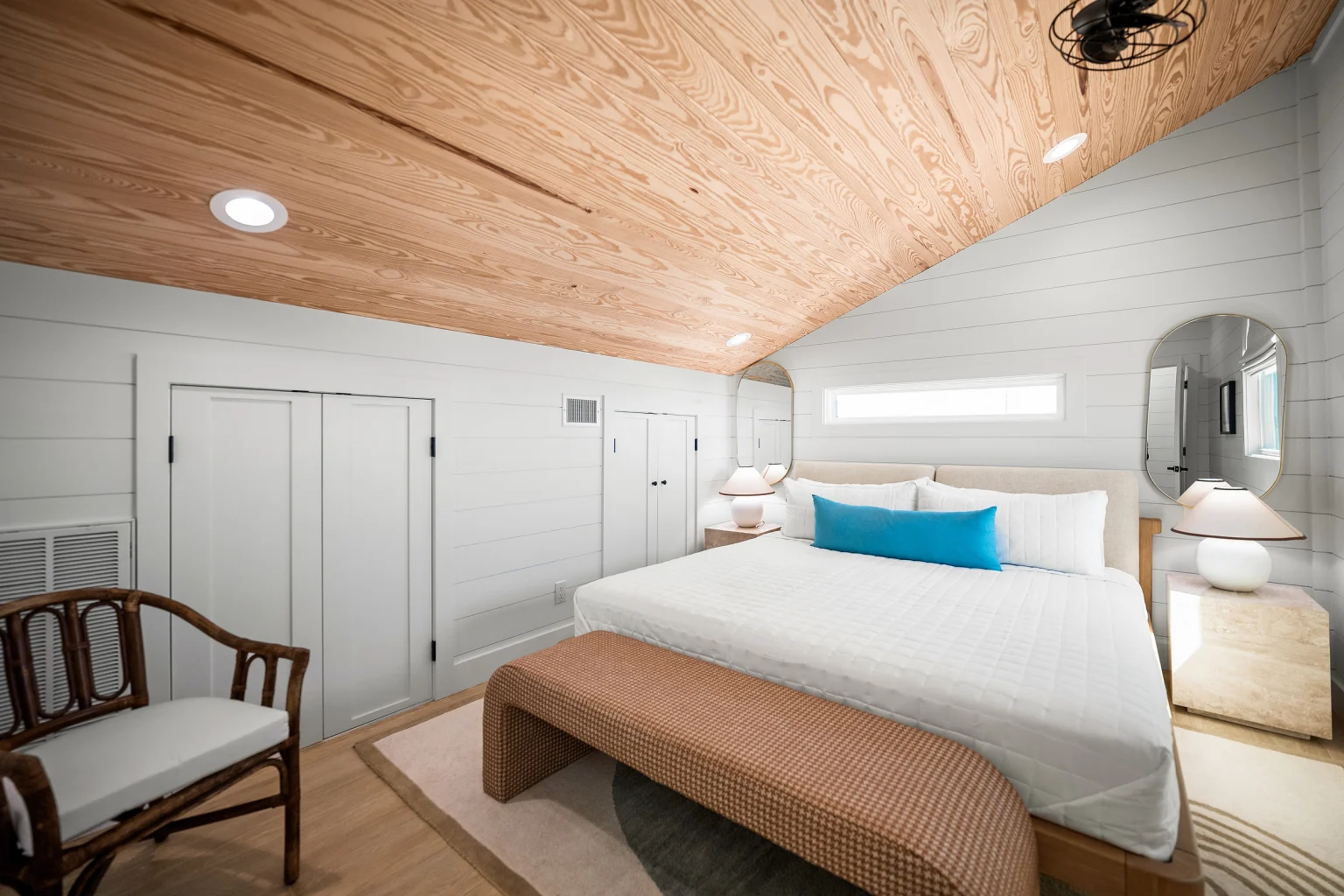 King bedroom with sloped wood ceiling, Love Shack