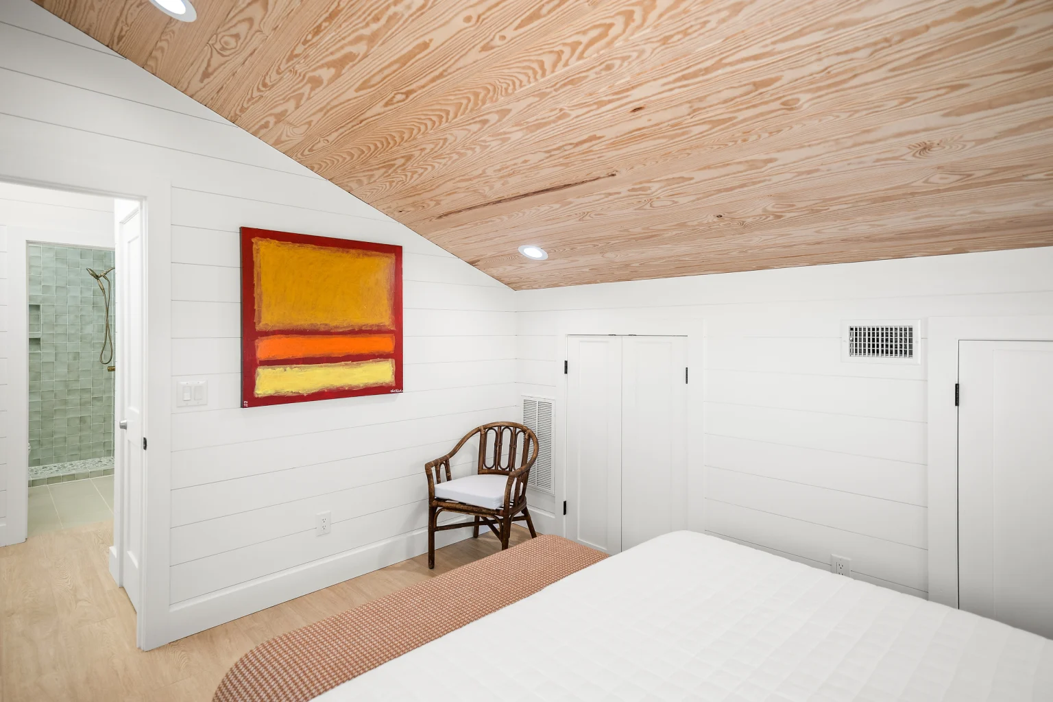 King bedroom with armchair and abstract art, Love Shack