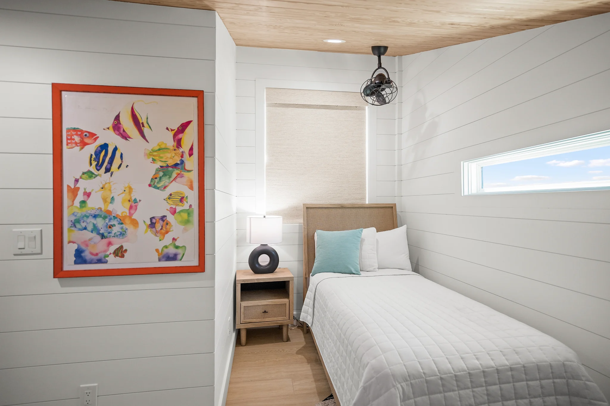 Twin bed with tropical fish art, Love Shack