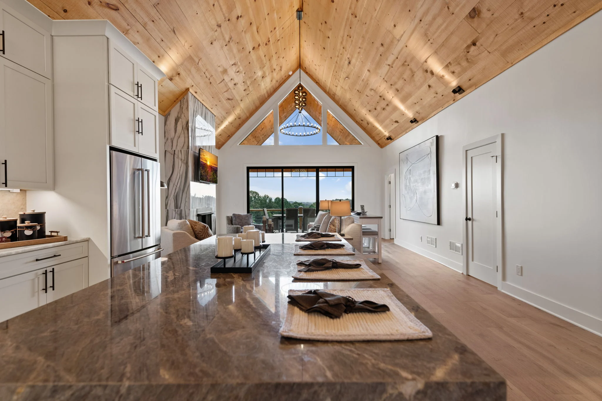Chef's kitchen with a large stone island, Modern Overlook