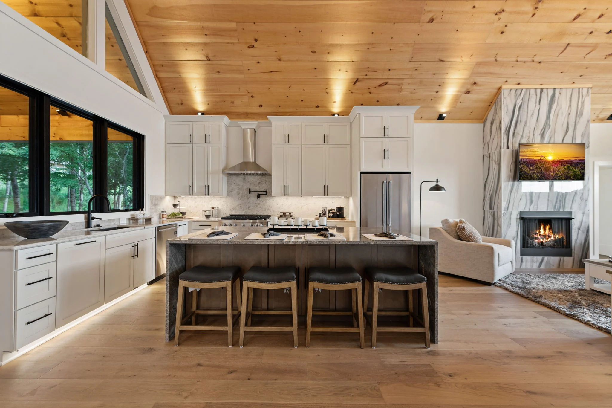 Chef's kitchen with a large stone island, Modern Overlook