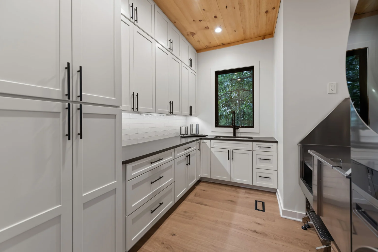 Laundry room with a stacked washer and dryer, Modern Overlook