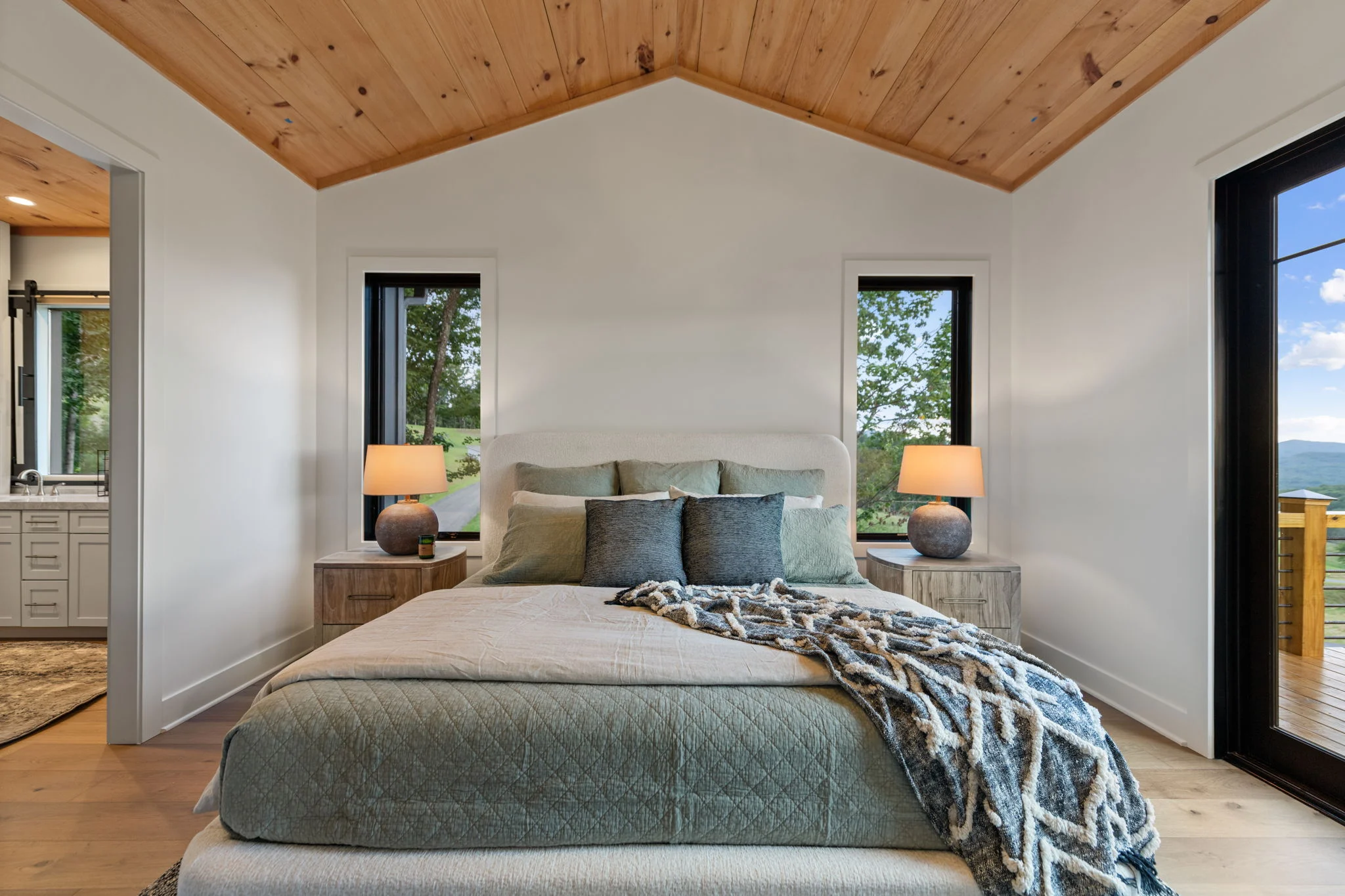 Primary bedroom with a door to the deck, Modern Overlook
