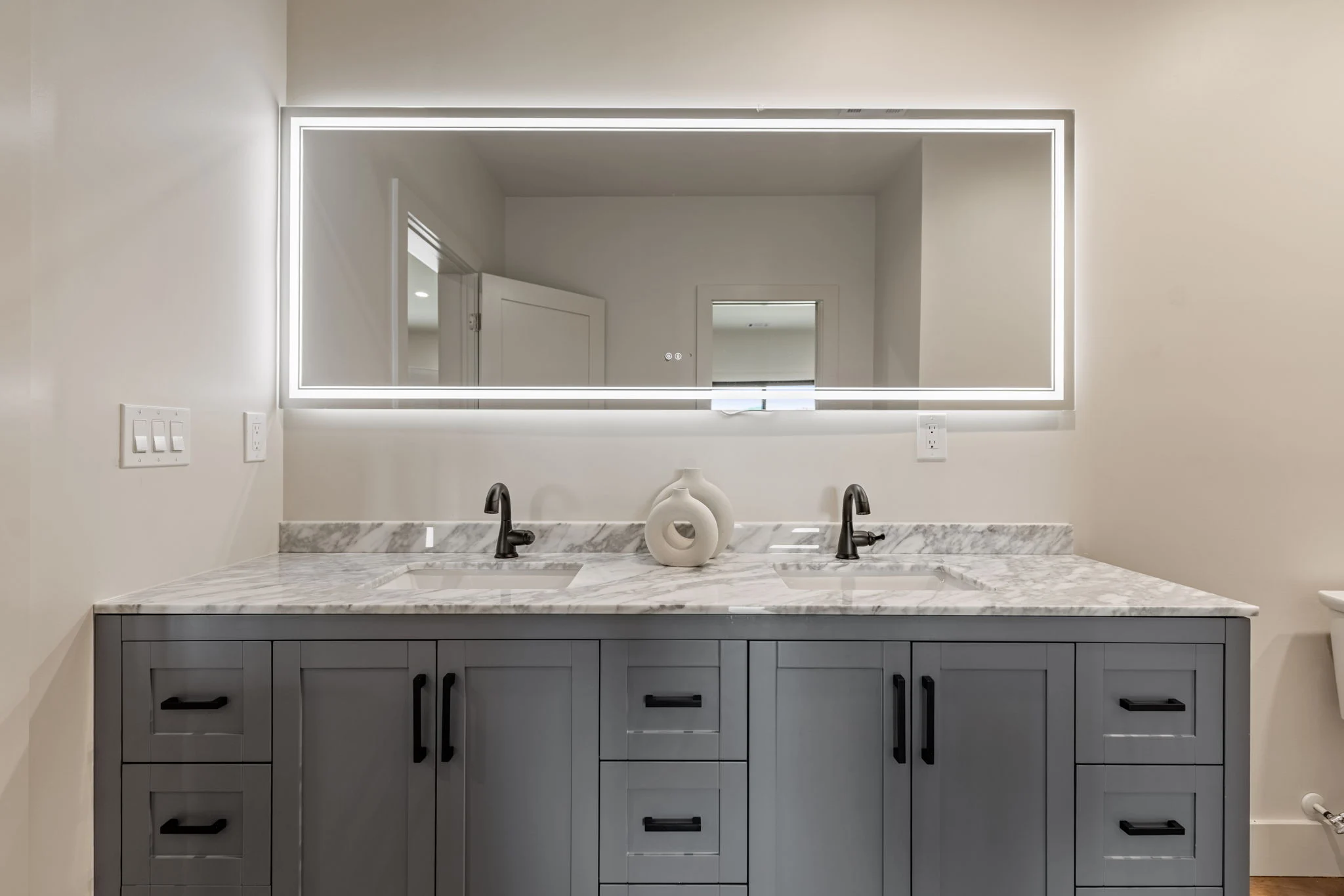 Terrace-level bathroom with a double vanity, Modern Overlook