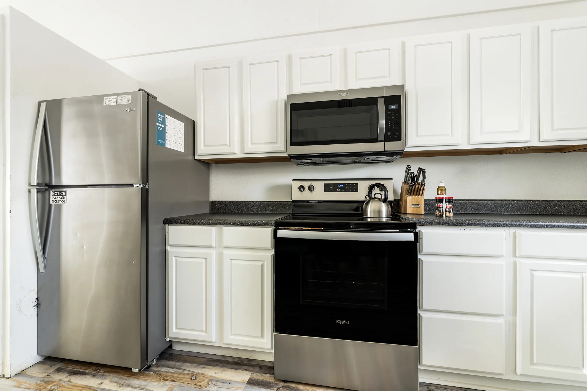 Kitchen with stainless range and refrigerator, Sands of Time