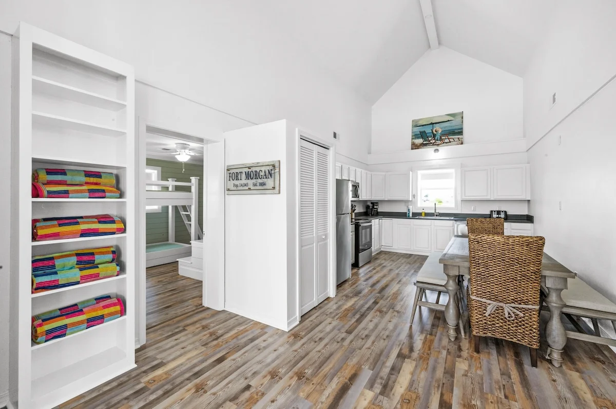 Hallway with built-in shelves and beach towels, Sands of Time