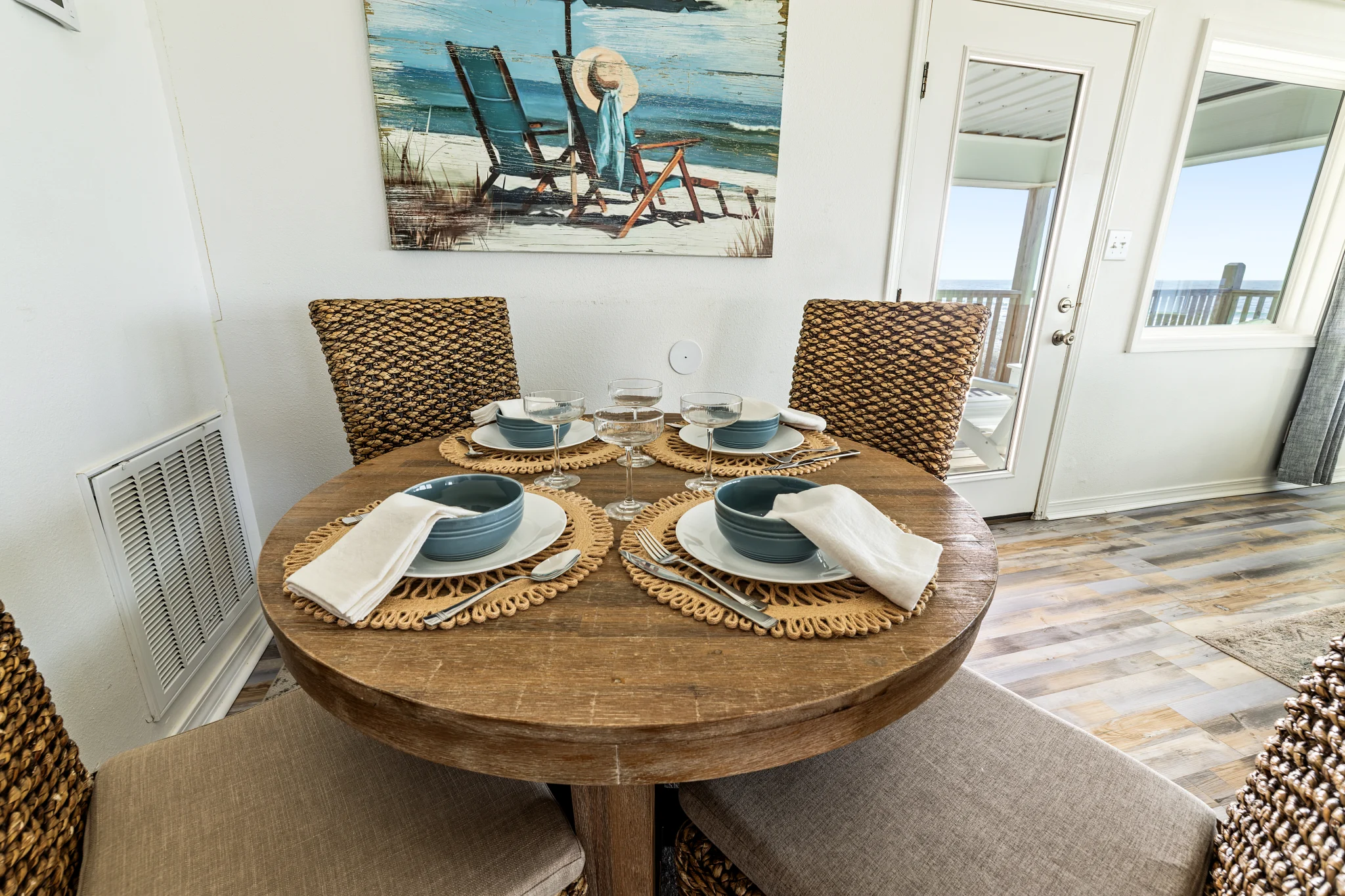 Round table set for four by the deck door, Sands of Time