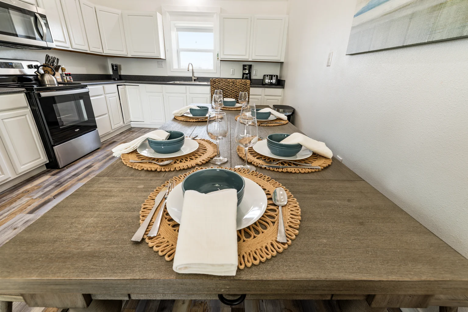 Long dining table set for a meal, Sands of Time