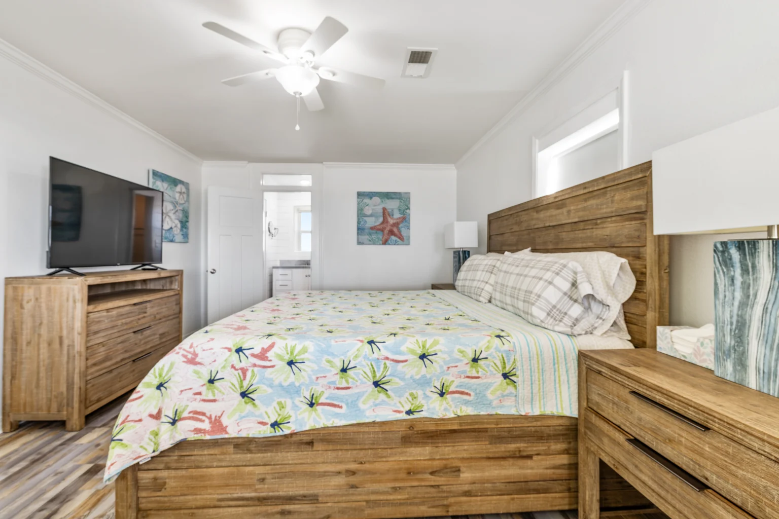 King bedroom with floral bedding, Sands of Time
