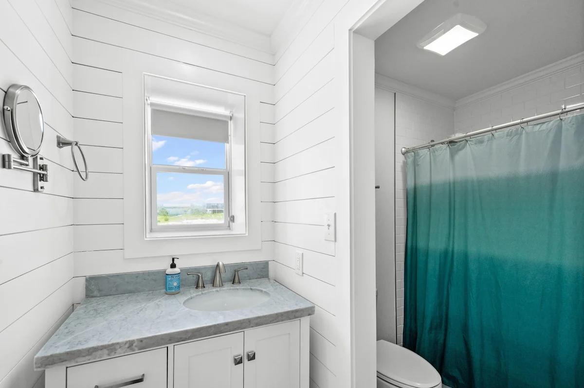 Bathroom with window and shower curtain, Sands of Time