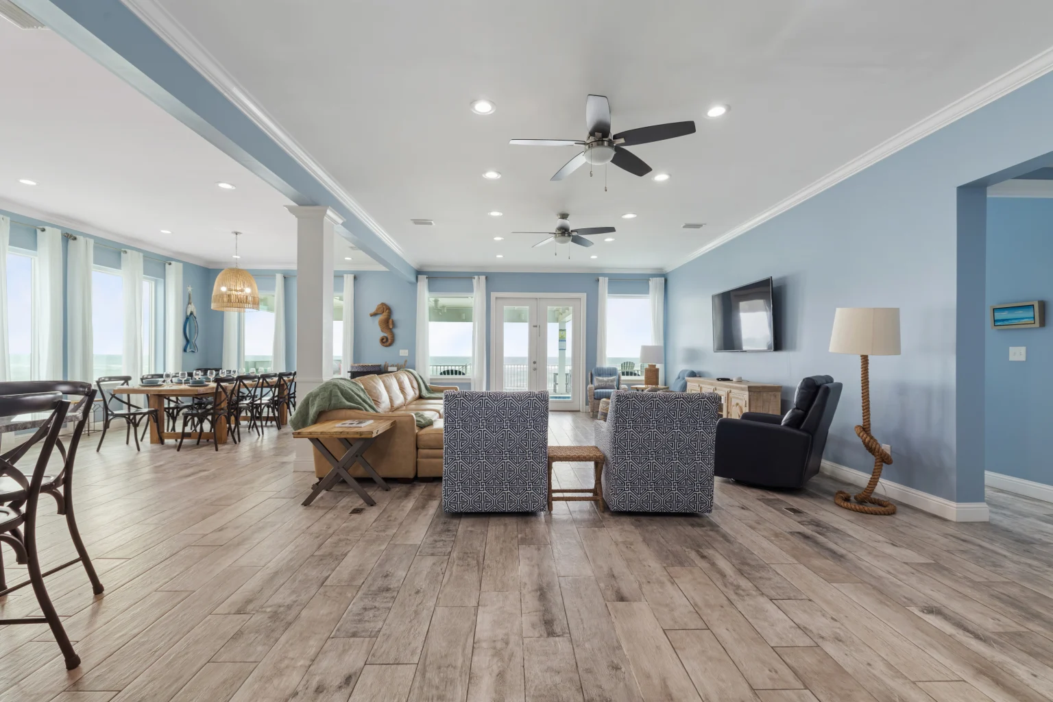 Open living and dining area with Gulf-view windows, Sea Bliss