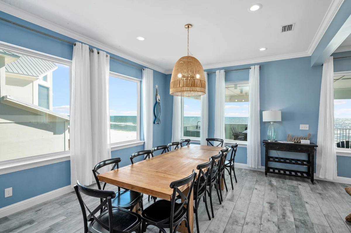 Dining table for twelve under a rattan pendant, Sea Bliss