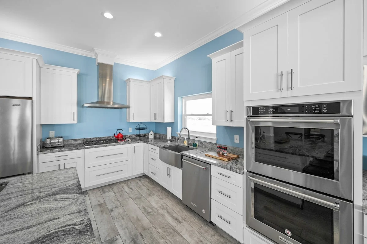 Kitchen with double wall ovens and granite counters, Sea Bliss