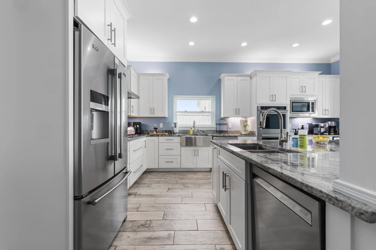 Kitchen with stainless refrigerator and island, Sea Bliss