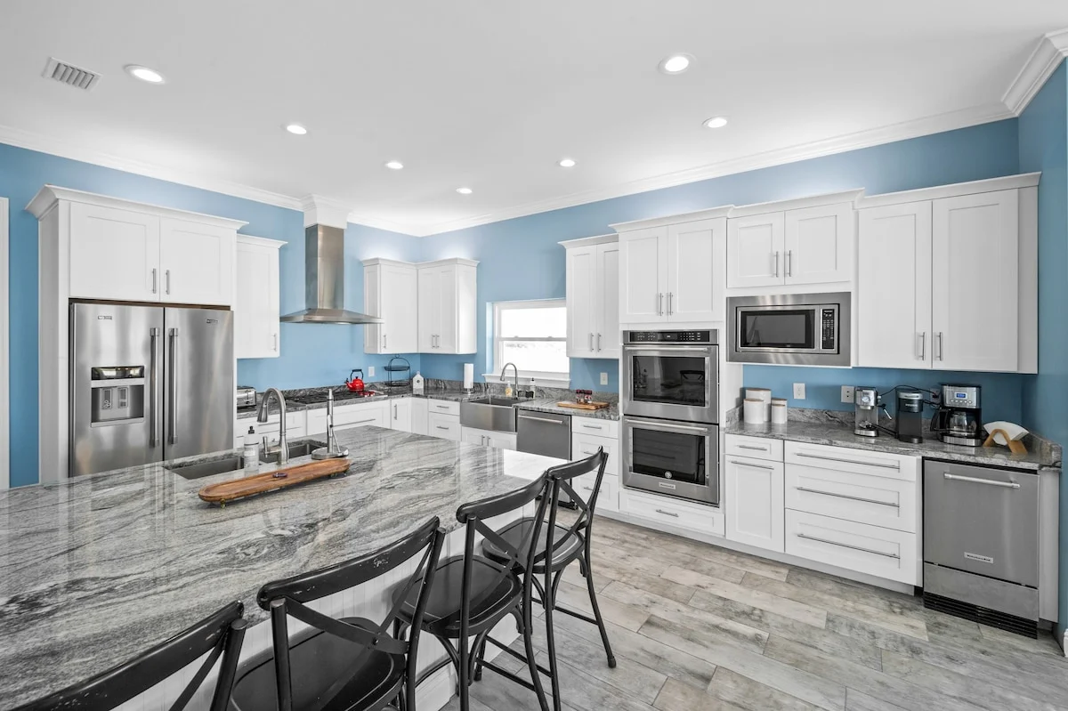 Large granite island with stools and double ovens, Sea Bliss