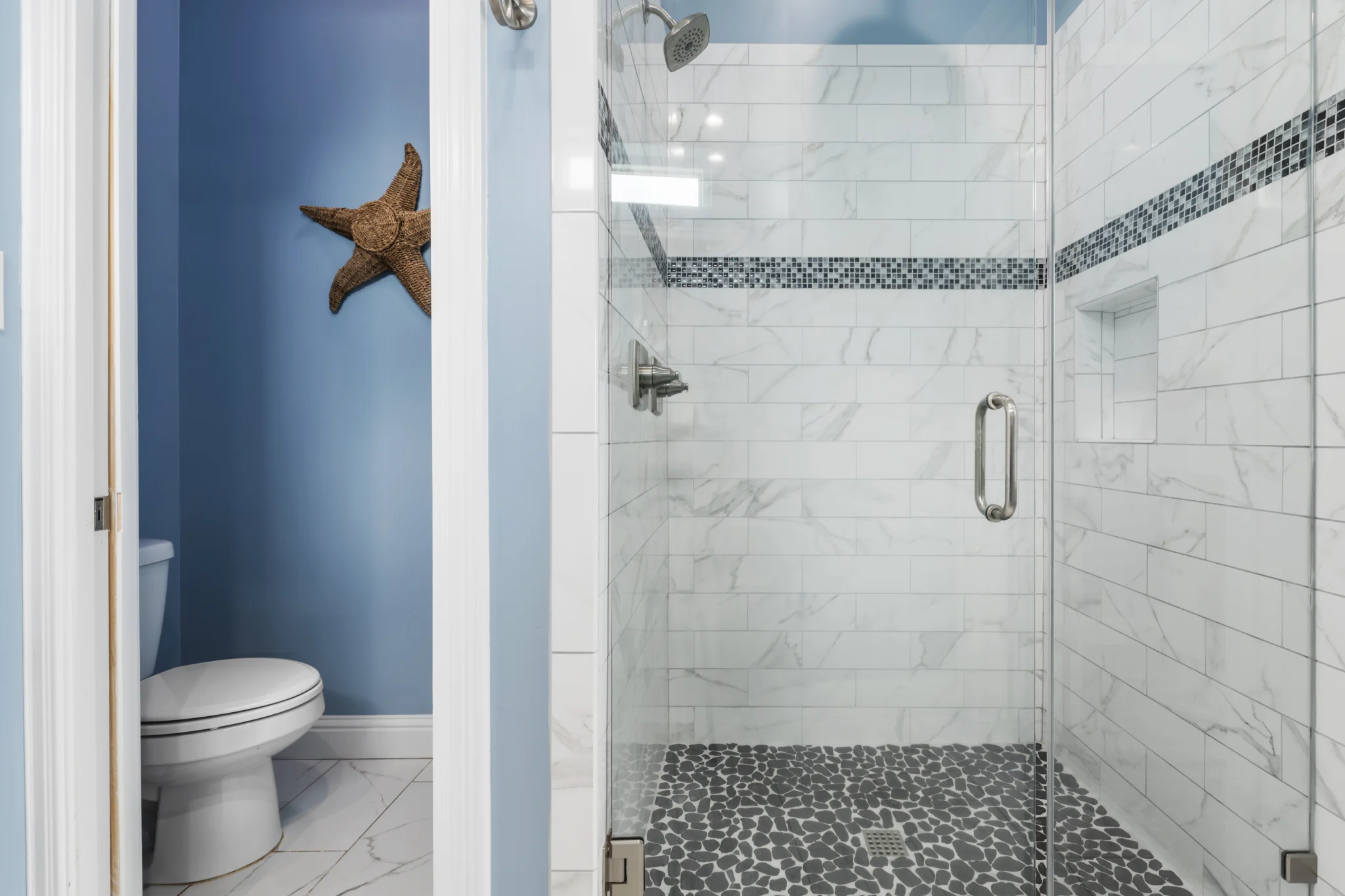 Tiled walk-in shower with pebble floor, Sea Bliss