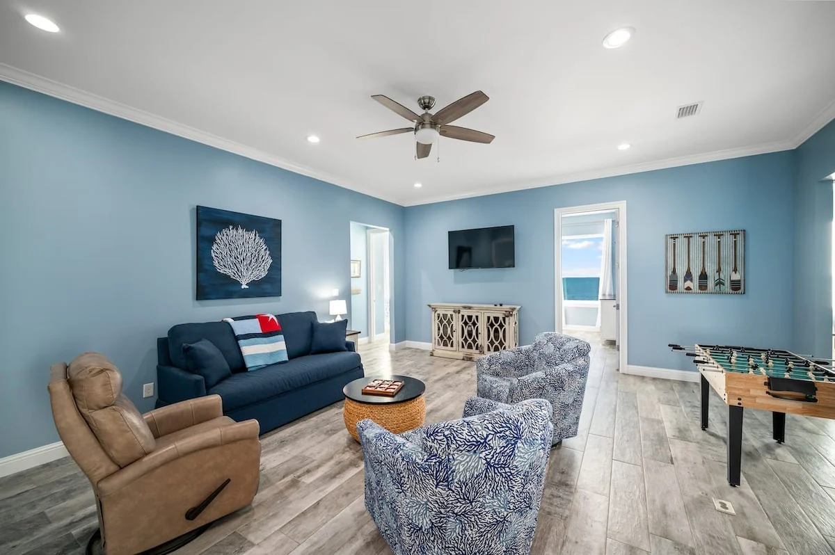 Upstairs living room with sofa and foosball table, Sea Bliss