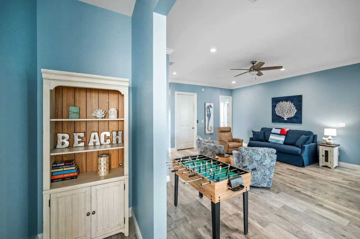 Bookshelf and foosball table in the upstairs lounge, Sea Bliss