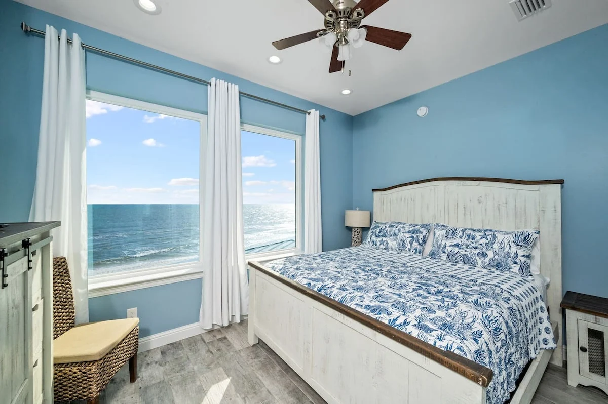 King bedroom with wicker chair and Gulf view, Sea Bliss