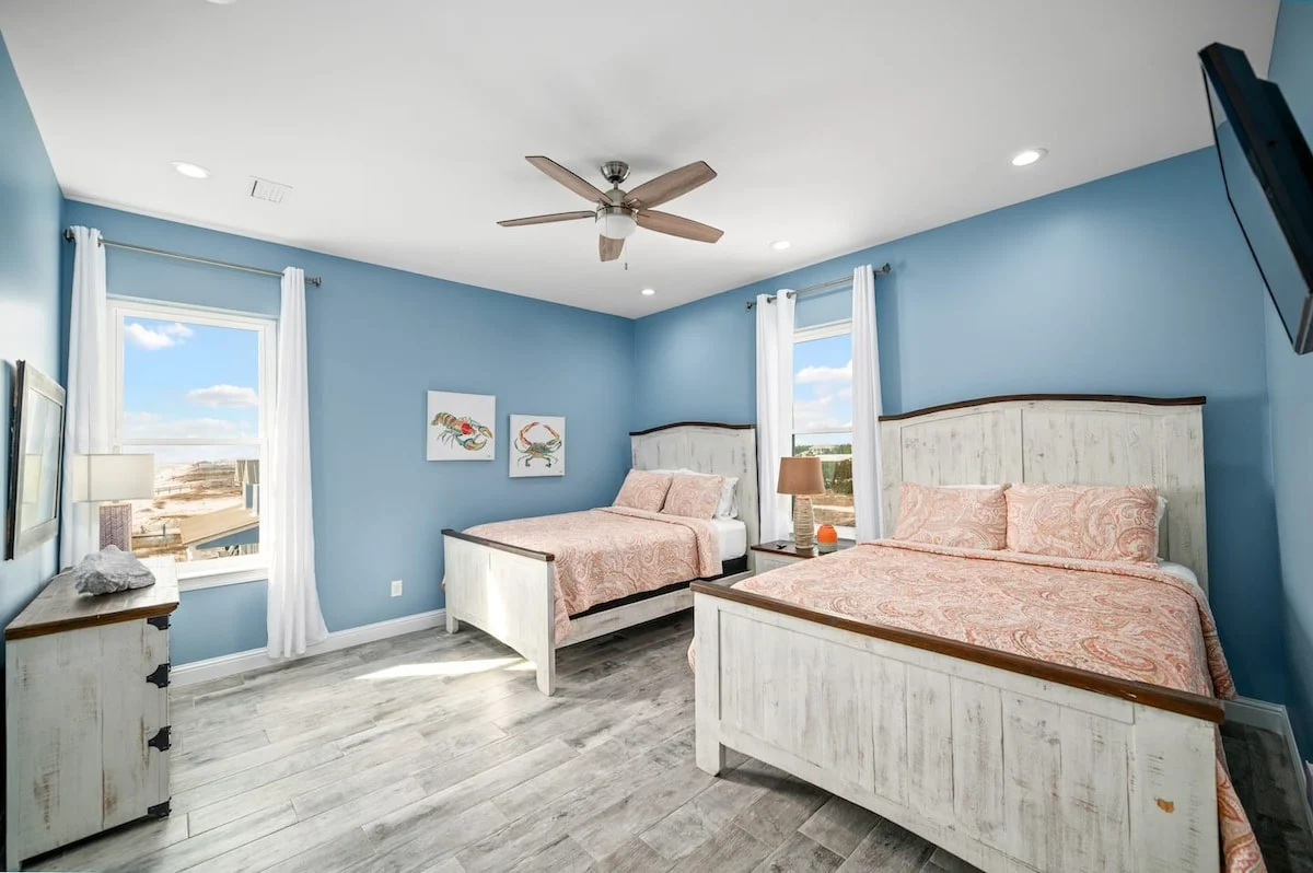 Bedroom with two queen beds and coral bedding, Sea Bliss